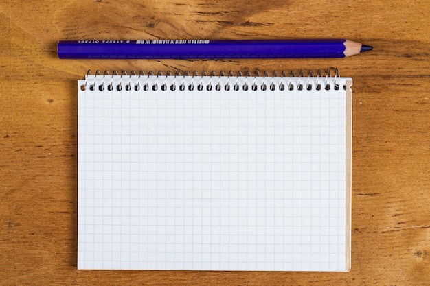 Notepad on the table with a pencil