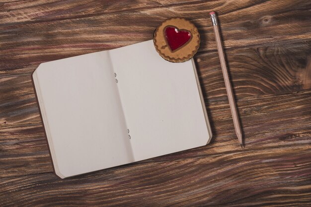 Notepad with a heart and a pencil next to it