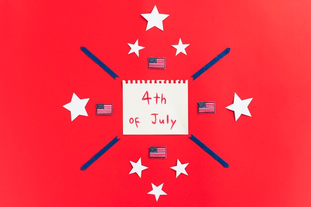 Notepad with inscription 4th of July and design with stars on red surface