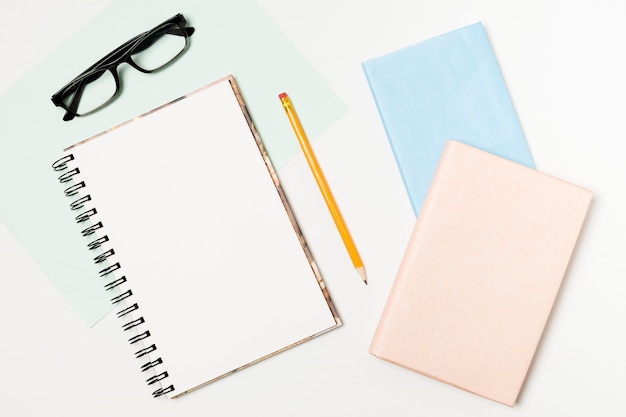 Notepads and glasses top view