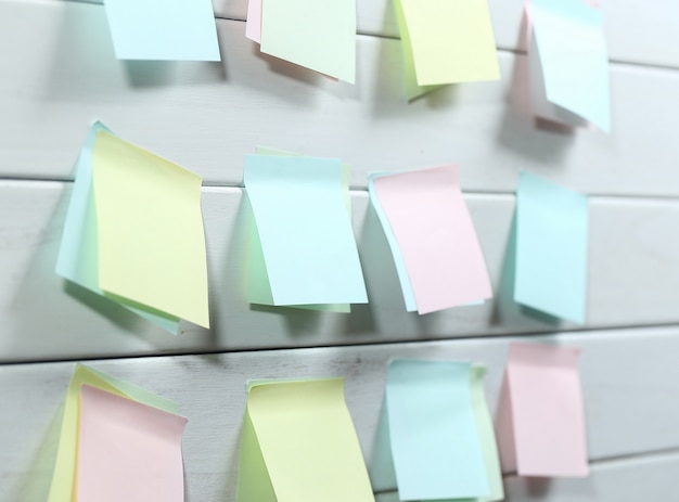 notepapers sticked on white wooden board