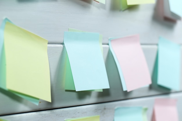 Notepapers sticked on white wooden board