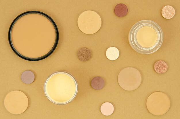 Nude make-up products on beige background