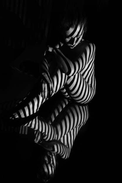 Free photo nude woman with black and white stripes