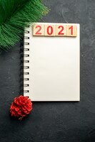 Number 2021 over notebook. happy new year