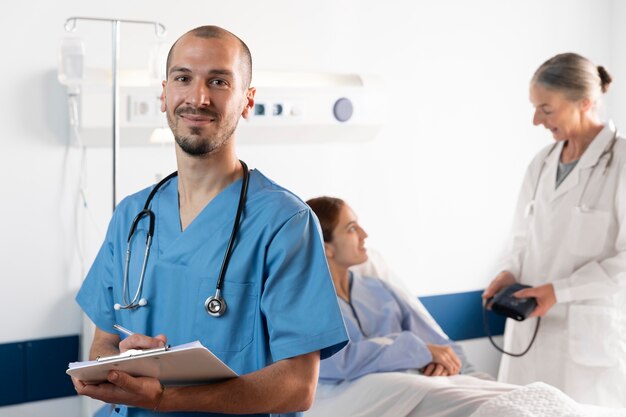 Nurse and doctor helping patient medium shot