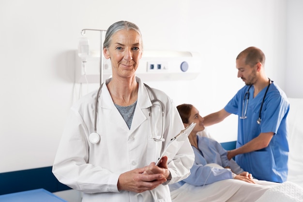 Free photo nurse and doctor helping patient