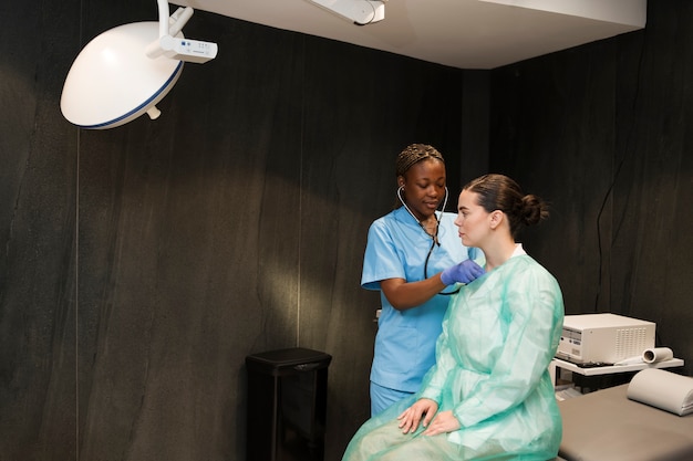 Free photo nurse wearing scrubs while working at the clinic