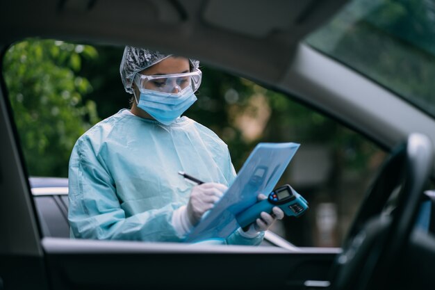 Nurse wears a protective suit and mask during the COVID19 outbreak.