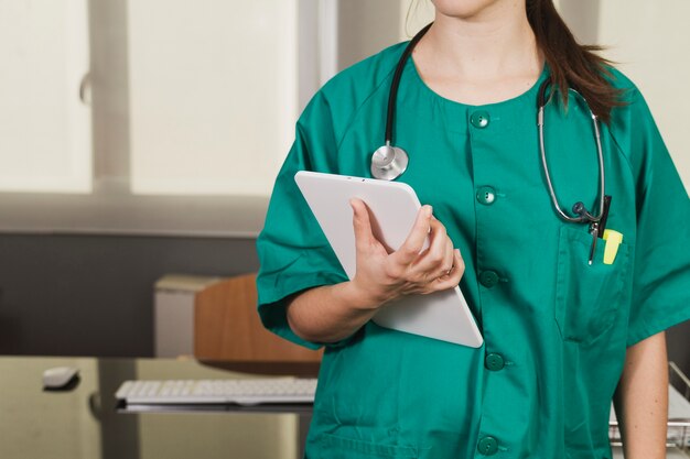 Nurse with checklist and stethoscope