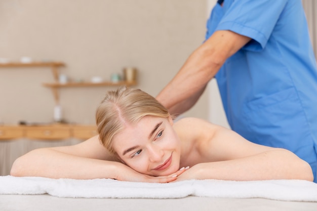 nurse with patient in osteopathy session