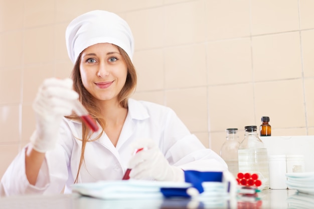 nurse works with blood sample