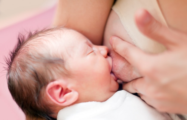 Nursing newborn baby