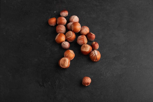 Nut shells on black surface. 