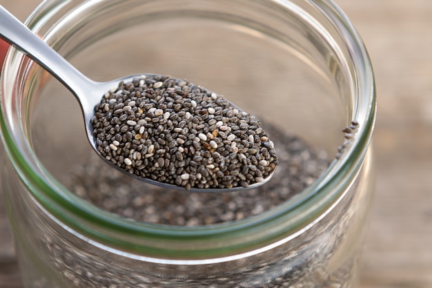 Free photo nutritious chia seeds on a spoon, close up.