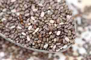 Free photo nutritious chia seeds on a spoon, close up.