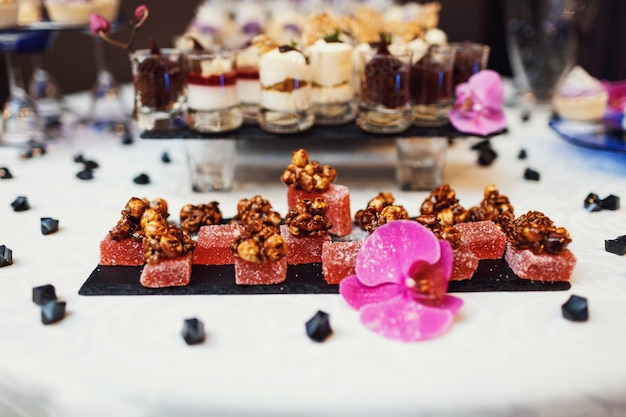 "Nuts on jellies served on festive table"