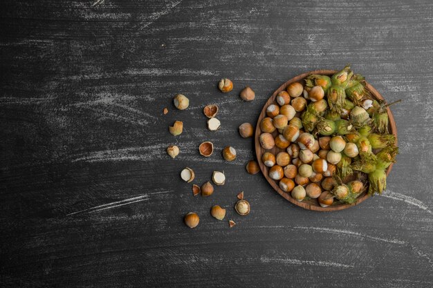 Nuts in shells with green leaves