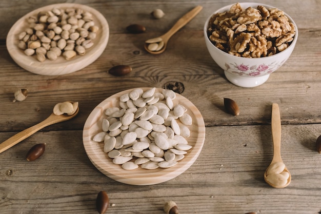 Nuts on wooden plates with spoons