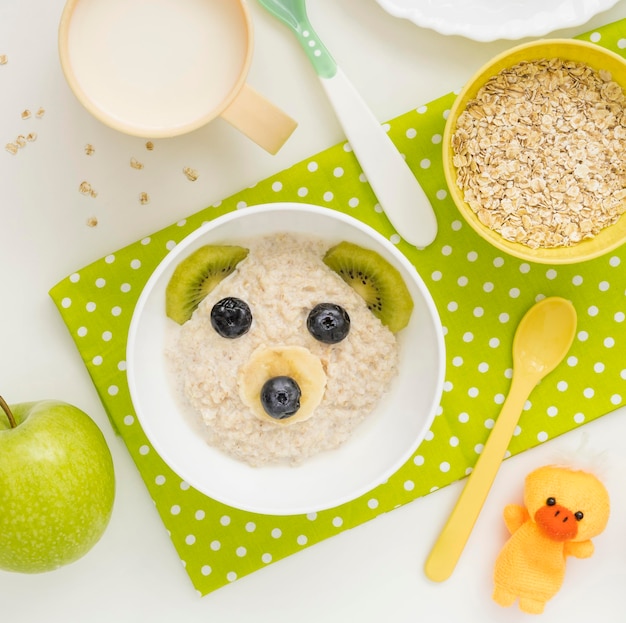 Oat flakes with milk baby food