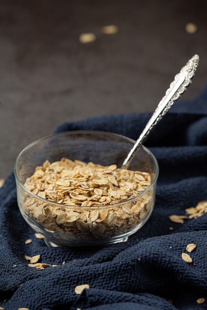 Oat grains and wheat spools in containers