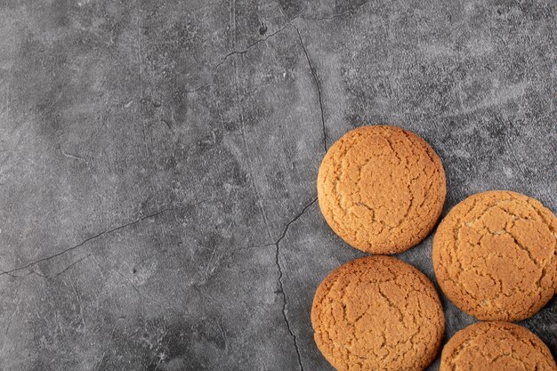 Oatmeal cookies isolated on grey concrete.