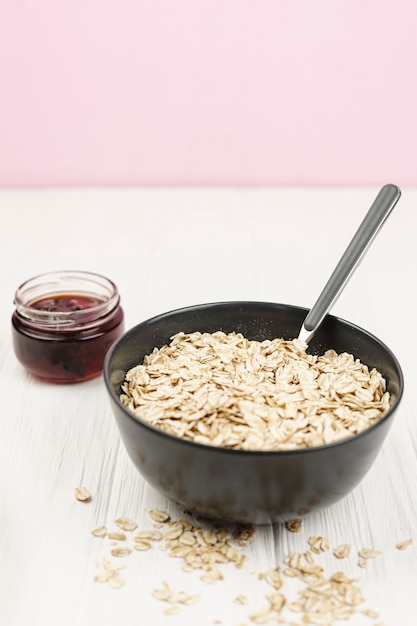 Oatmeal porridge bowl with jam