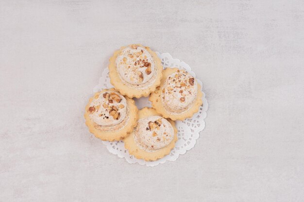 Oatmeal raisin cookies on white table.