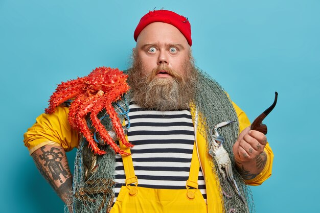 Obese bearded male sailor wiith fishing net