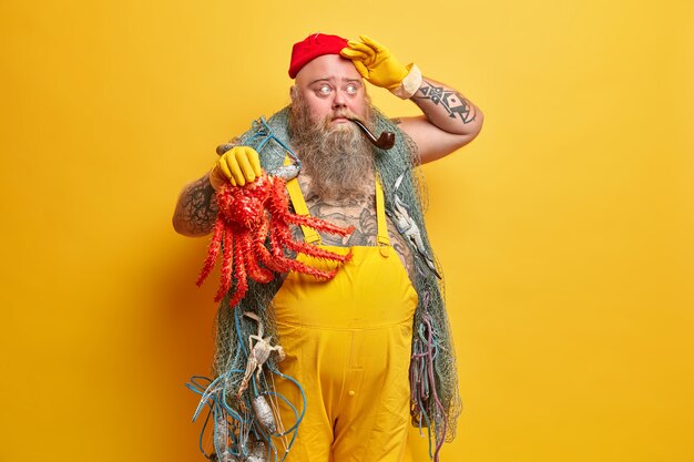 Obese bearded male sailor wiith fishing net