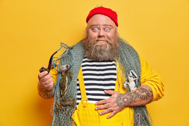 Obese bearded male sailor wiith fishing net