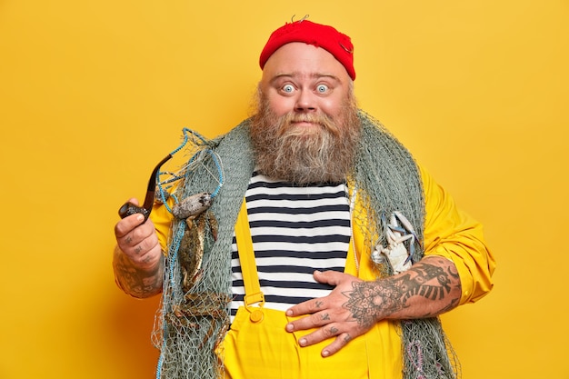 Obese bearded male sailor wiith fishing net