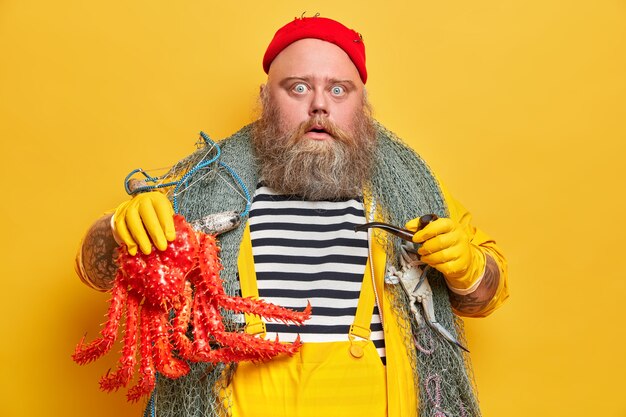 Obese bearded male sailor wiith fishing net