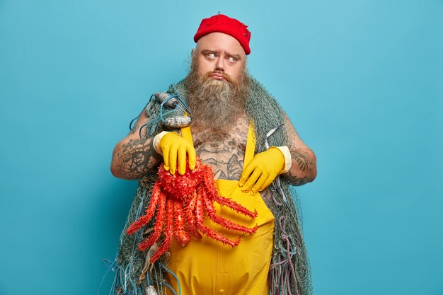 Obese bearded male sailor wiith fishing net