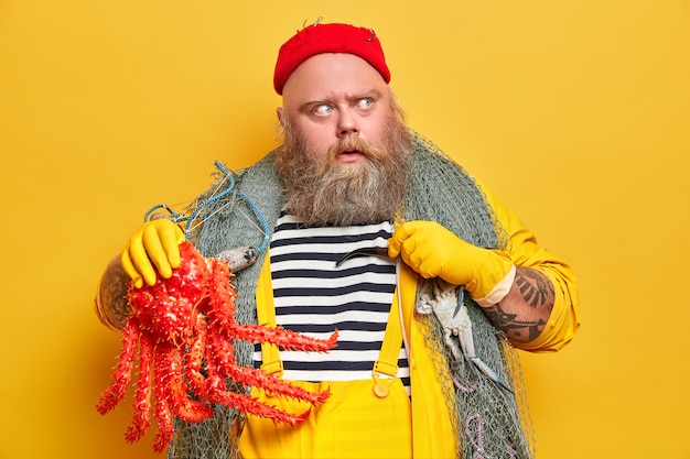 Obese bearded male sailor wiith fishing net