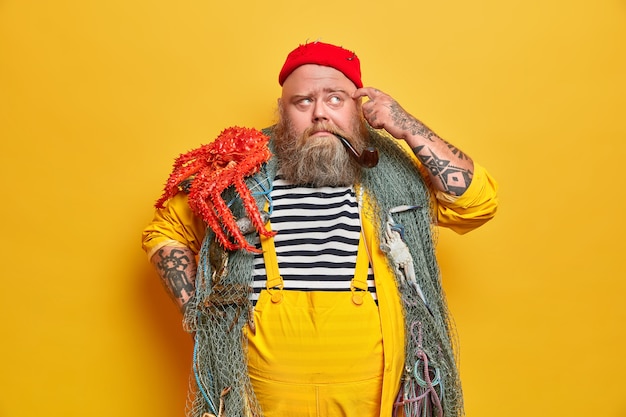 Obese bearded male sailor wiith fishing net