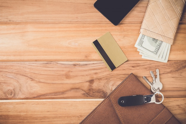 Objects of businessmen placed on brown wood plates.