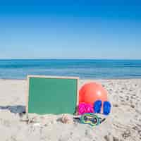 Free photo objects in composition on sandy beach