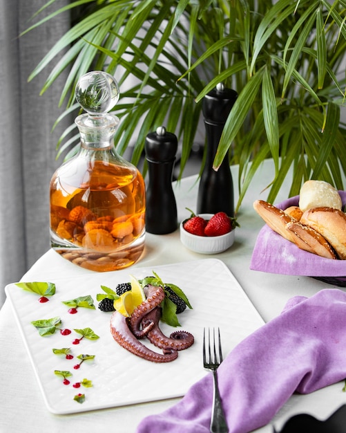 Octopus with berries on the table