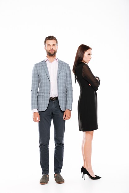 Offence young loving couple standing isolated