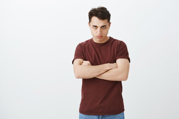 Offended disappointed attractive guy in casual clothes