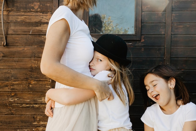 Offended girl hugging mother