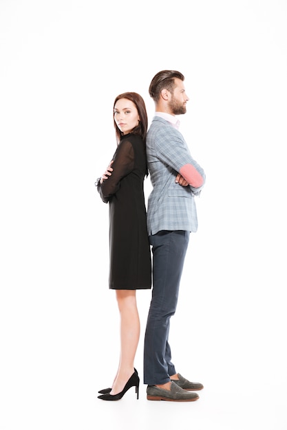 Free photo offended loving couple standing isolated