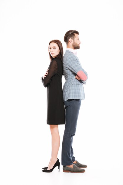 Offended loving couple standing isolated