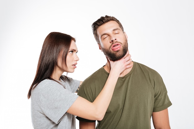 Offended young loving couple swear isolated