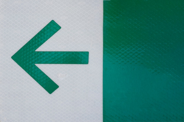Office arrow on grey and green background