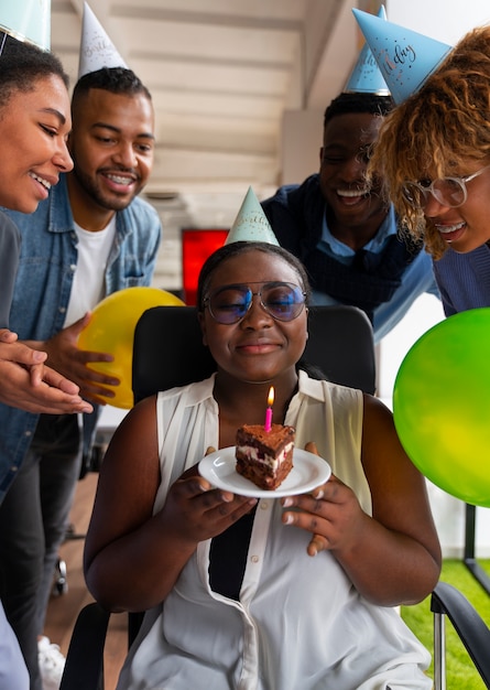 Office coworkers celebrating an event with balloons