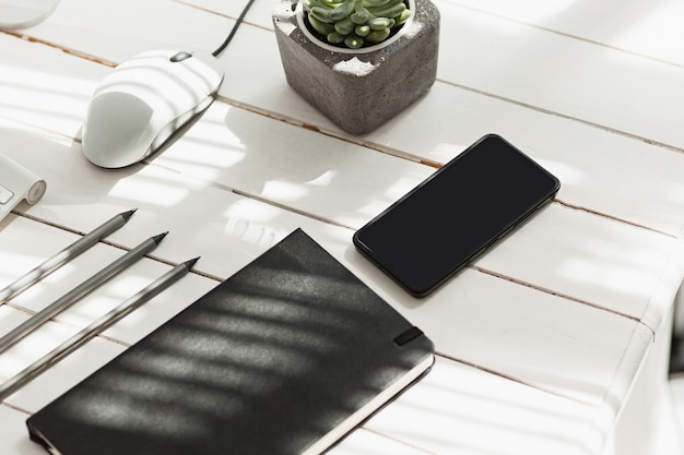 Office desk table with computer, supplies and phone