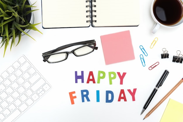 Free photo office desk table with happy friday word