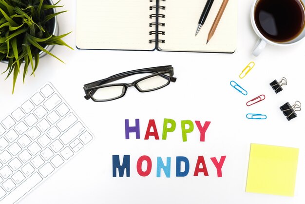 Office desk table with happy monday word